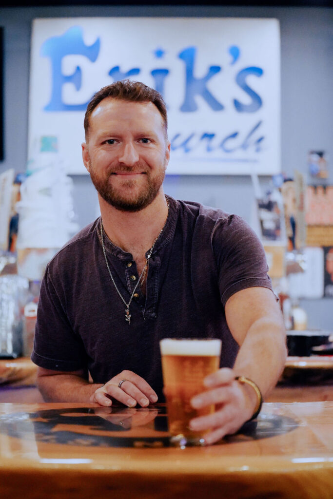 Erik's Church Bar & Grill - Male Bartender Holding Beer