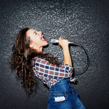 Woman,Singing,With,Microphone